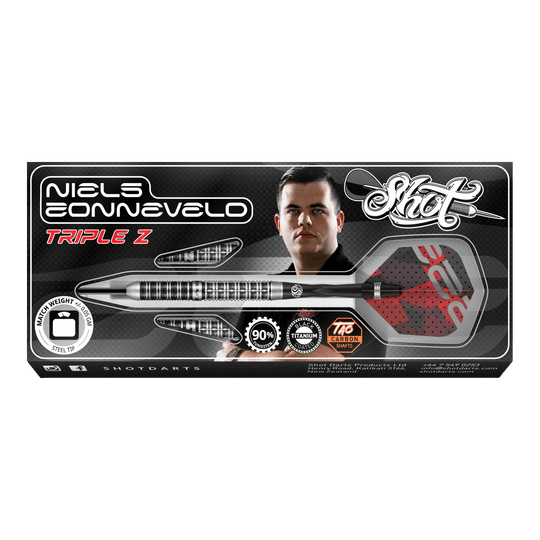 Ocelové šipky Niels Zonneveld V2 Auf dem Bild ist die Verpackung der "Shot Niels Zonneveld V2 Steeldarts" zu sehen. Die Verpackung zeigt einen Dartpfeil, das Logo und ein Porträt von Niels Zonneveld.
