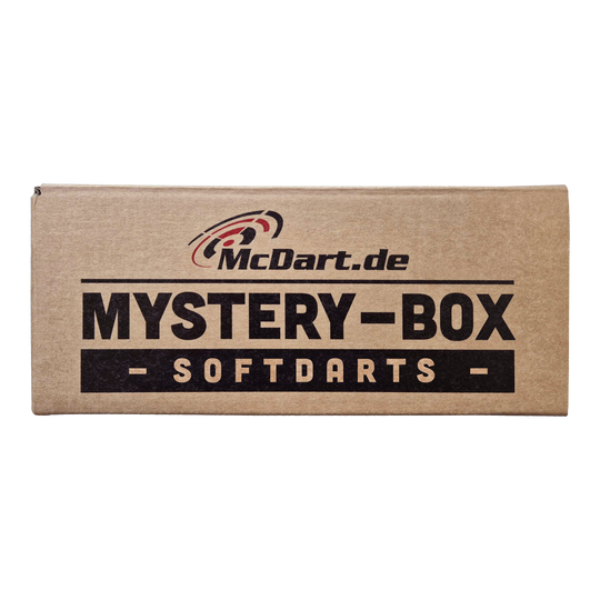 Auf dem Bild ist eine braune Box mit der Aufschrift "McDart.de Mystery-Box - Softdarts -" zu sehen. Die Verpackung wirkt spannend und macht neugierig auf den Inhalt für Dart-Fans.