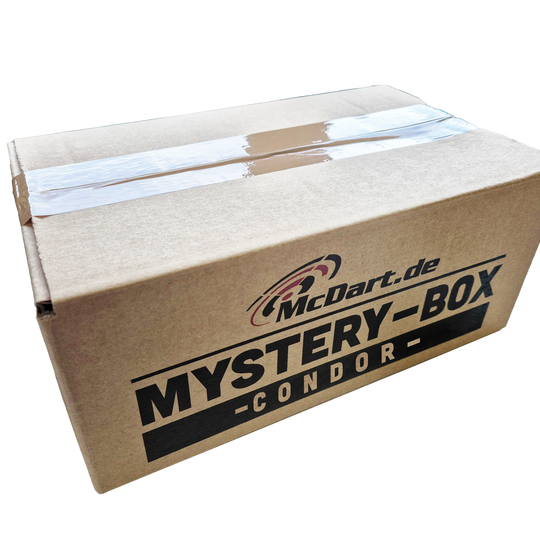 Auf dem Bild ist ein brauner Karton mit der Aufschrift "McDart.de Mystery-Box Condor" zu sehen. Der Karton ist mit Klebeband versiegelt.