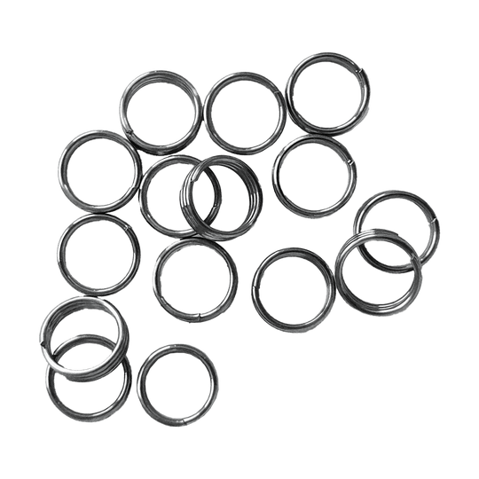 McDart Shaftringe - 5 Sets Auf dem Bild sind mehrere silberne Ringe zu sehen, die sogenannten McDart Shaftringe. Es handelt sich dabei um 5 Sets, die als Zubehör für Dartpfeile verwendet werden.