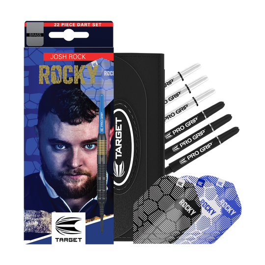Šipky Target Josh Rock Brass měkké - 18g Das Bild zeigt das Produkt "Target Josh Rock Brass Softdarts - 18g" mit Zubehör wie Flights und Shafts. Auf der Verpackung ist ein Porträt sowie der Name des Spielers Josh Rock zu sehen.